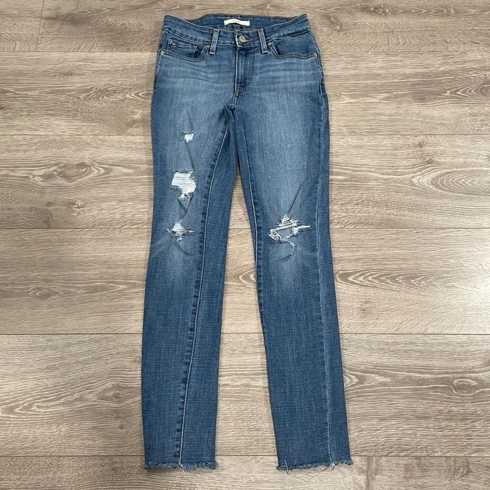 Levi’s 711 Skinny distressed mid rise ankle raw hem denim jeans W24 L30